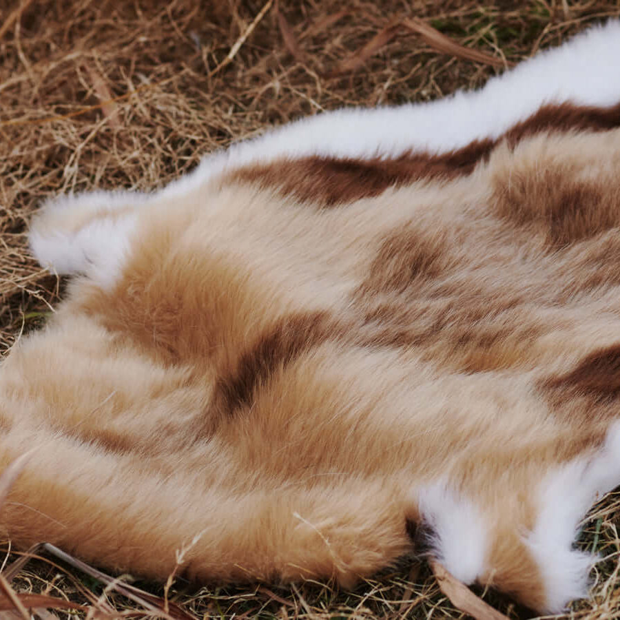 A close up of a high-end Faux Impala Pelt Rug which is designed with inspiration from the great wild African antelope impala.