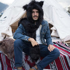 The model is wearing a black faux fur hood with a scarf and gloves. It's extremely warm and keep you away from coldness.