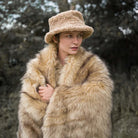 The king size long pile golden faux fur blanket has unbelievable soft velvet lining and 100% cruelty-free luxurious fur.