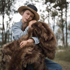 The king size long pile brown faux fur blanket has unbelievable soft velvet lining and 100% cruelty-free luxurious fur.