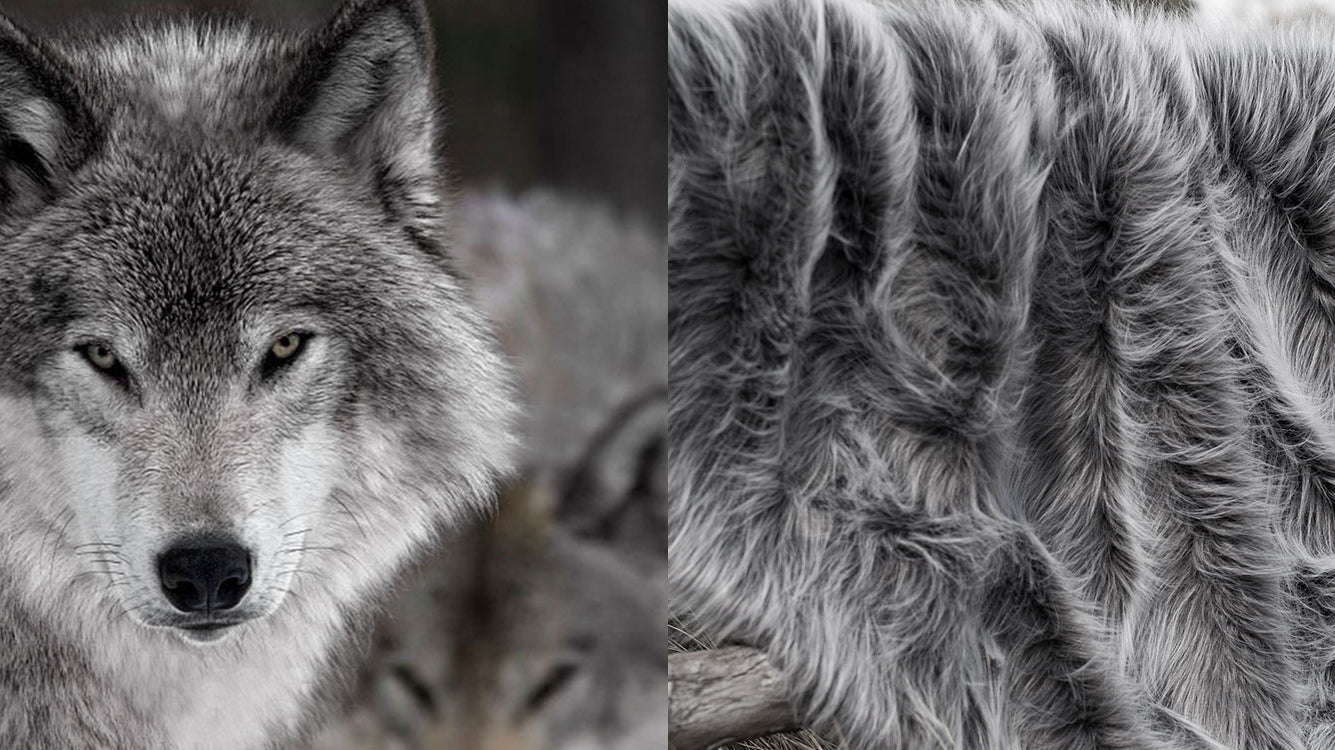 A fluffy grey long pile faux fur blanket that looks and feels like real fur from a grey wolf.