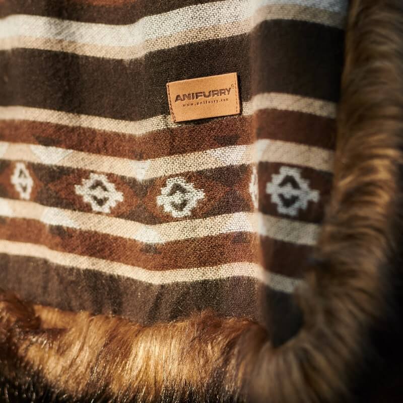 Reversible Aztec style blanket with anifurry label exposed.