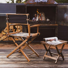 Anifurry Mohave Director Chair and a small stool on a wooden deck with a fire pit in the background