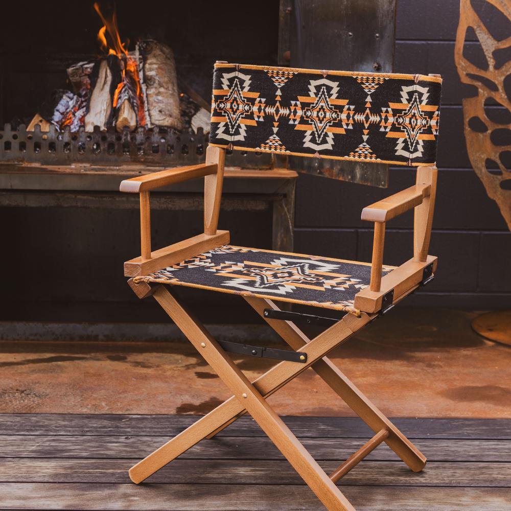 Anifurry Mohave director chair with a patterned seat and backrest in front of a fireplace