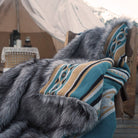 Outside the camping tent, Aztec faux fur long pile blanket spread on the chair. Suitable for outsides and RV use.
