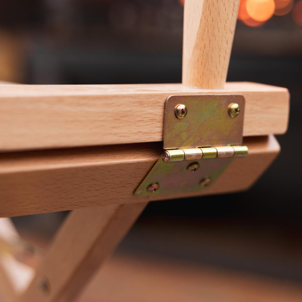 Close-up of a Beige Moab Director Chair with a brass hinge against
