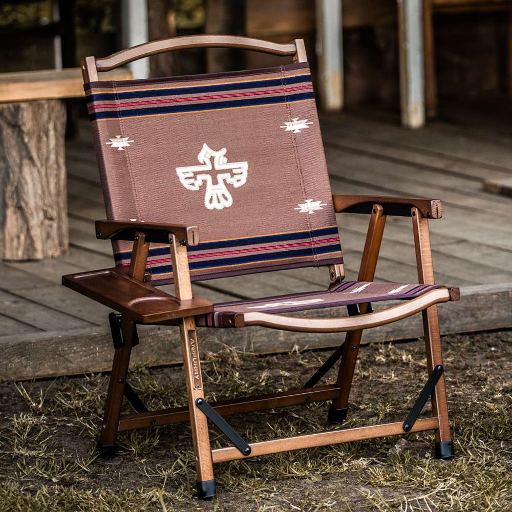 Outdoor chair with a wooden frame and a thunderbird pattern designed by Anifurry.