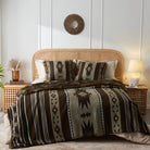The bright bedroom was covered with reversible brown aztec and brown faux fur sets on the bed.