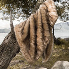 The golden faux fur blanket is great for both decoration and keeping warm. It's easy to wash and extremely soft.
