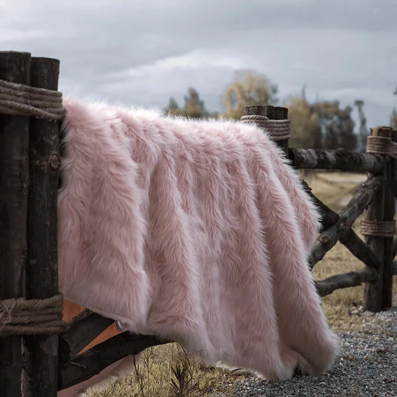 The pink faux fur blanket is great for both decoration and keeping warm. It's easy to wash and extremely soft.